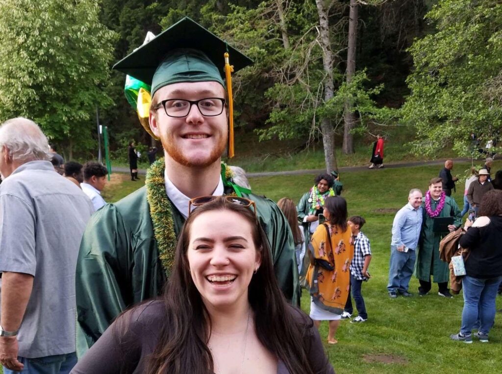 Young couple at graduation. New family starting out.