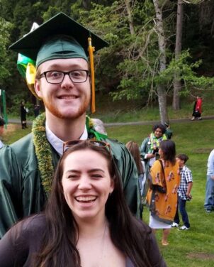 Young couple at graduation. New family starting out.