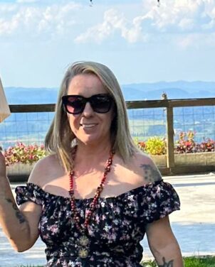 Woman over 50 on swing at the ocean